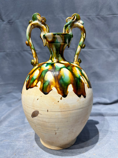 Tang Sancai double - dragon - handled vase. With ancient charm and flowing colors, it is exquisitely hand - crafted. Its unique shape and rare beauty make it an excellent choice for collectors!