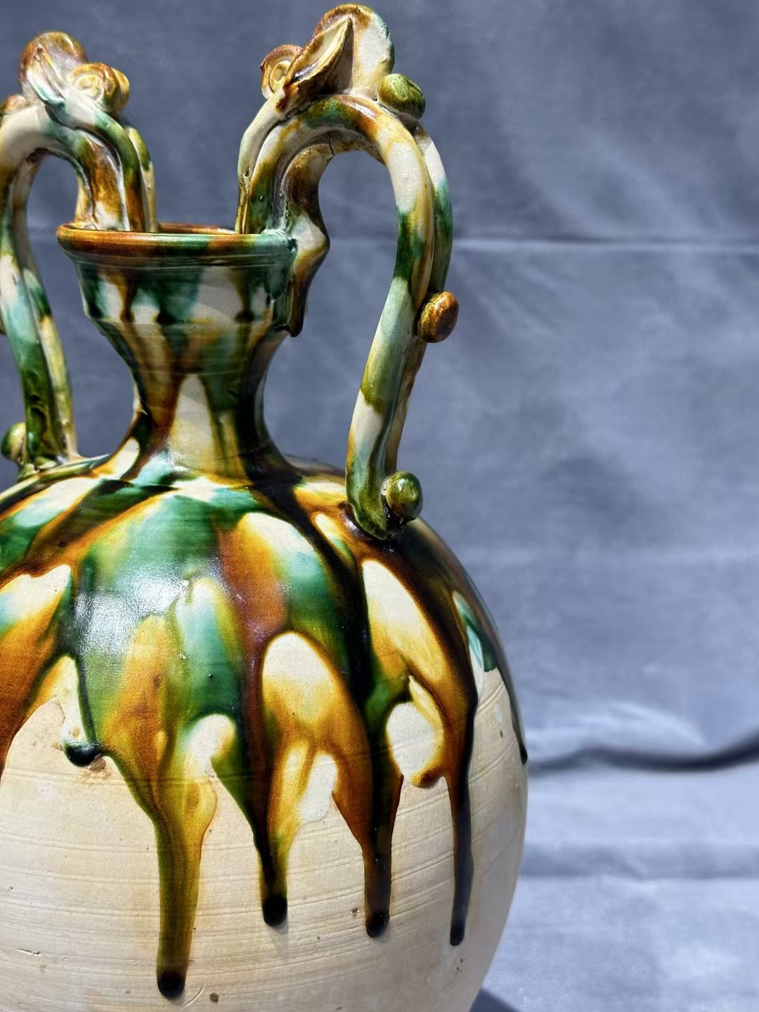 Tang Sancai double - dragon - handled vase. With ancient charm and flowing colors, it is exquisitely hand - crafted. Its unique shape and rare beauty make it an excellent choice for collectors!