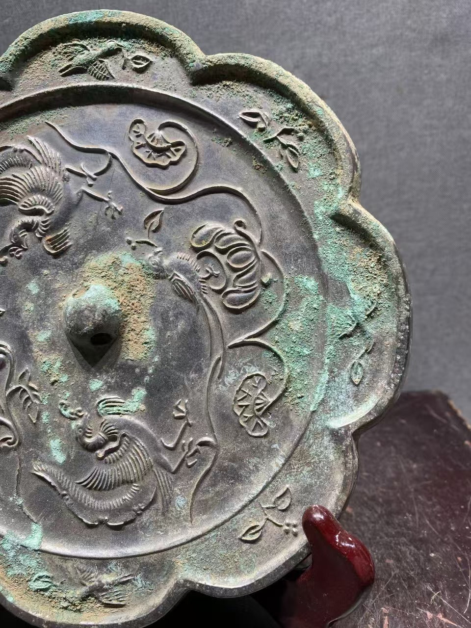 Bronze mirror with flower - bird patterns from Tang Dynasty, reflecting the elegance of life through the ages