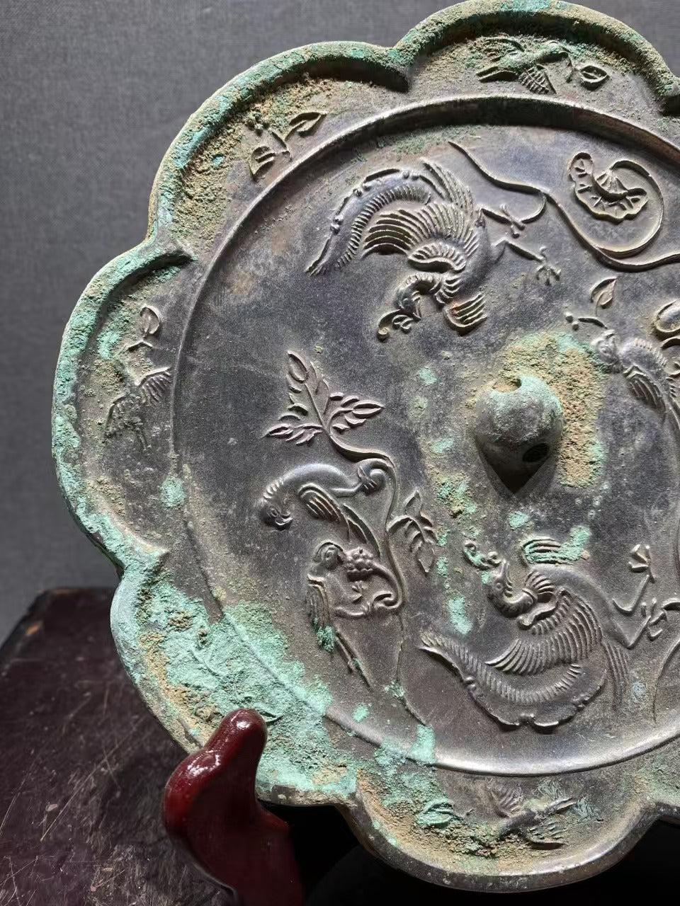 Bronze mirror with flower - bird patterns from Tang Dynasty, reflecting the elegance of life through the ages