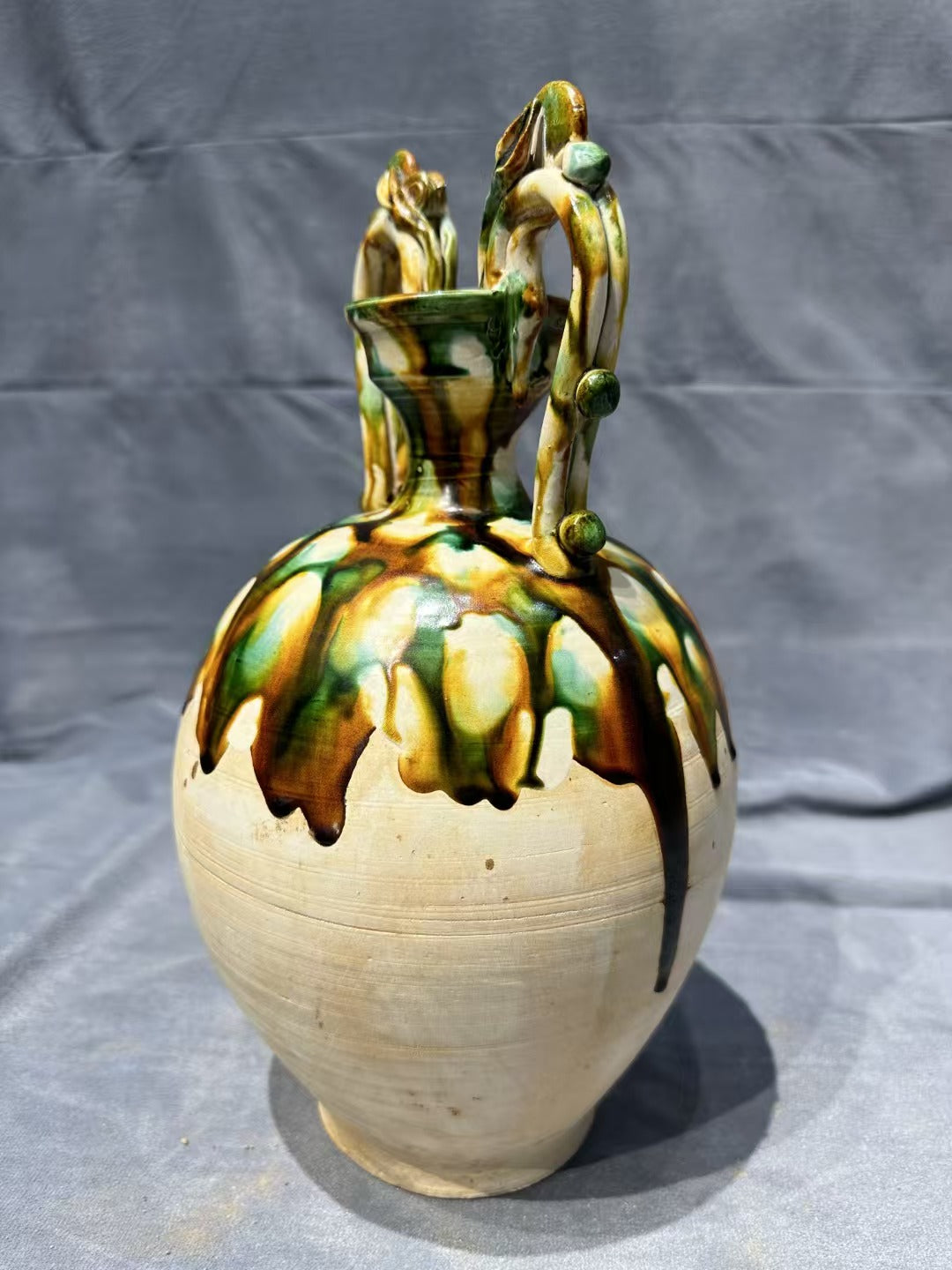 Tang Sancai double - dragon - handled vase. With ancient charm and flowing colors, it is exquisitely hand - crafted. Its unique shape and rare beauty make it an excellent choice for collectors!