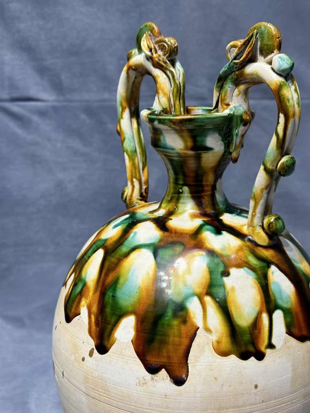 Tang Sancai double - dragon - handled vase. With ancient charm and flowing colors, it is exquisitely hand - crafted. Its unique shape and rare beauty make it an excellent choice for collectors!