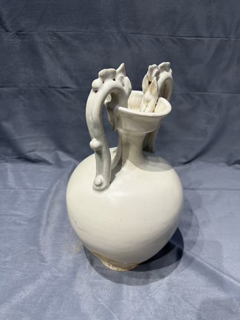 Collectors' must - have! This white porcelain vase with double - dragon - shaped handles, crafted by traditional techniques, is rare and full of ancient charm, perfect for your home.